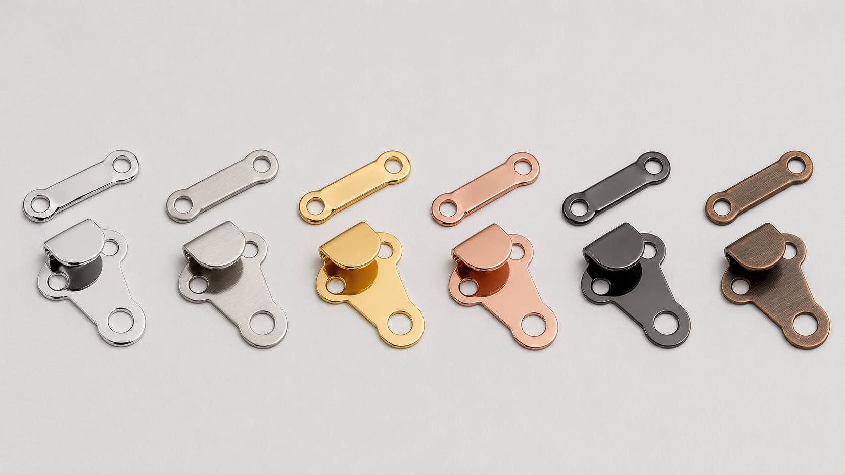 waistband hooks and bars, Waistband hooks and bars in silver, gold, rose gold, black and antique bronze finishes are arranged in matching sets on a light background